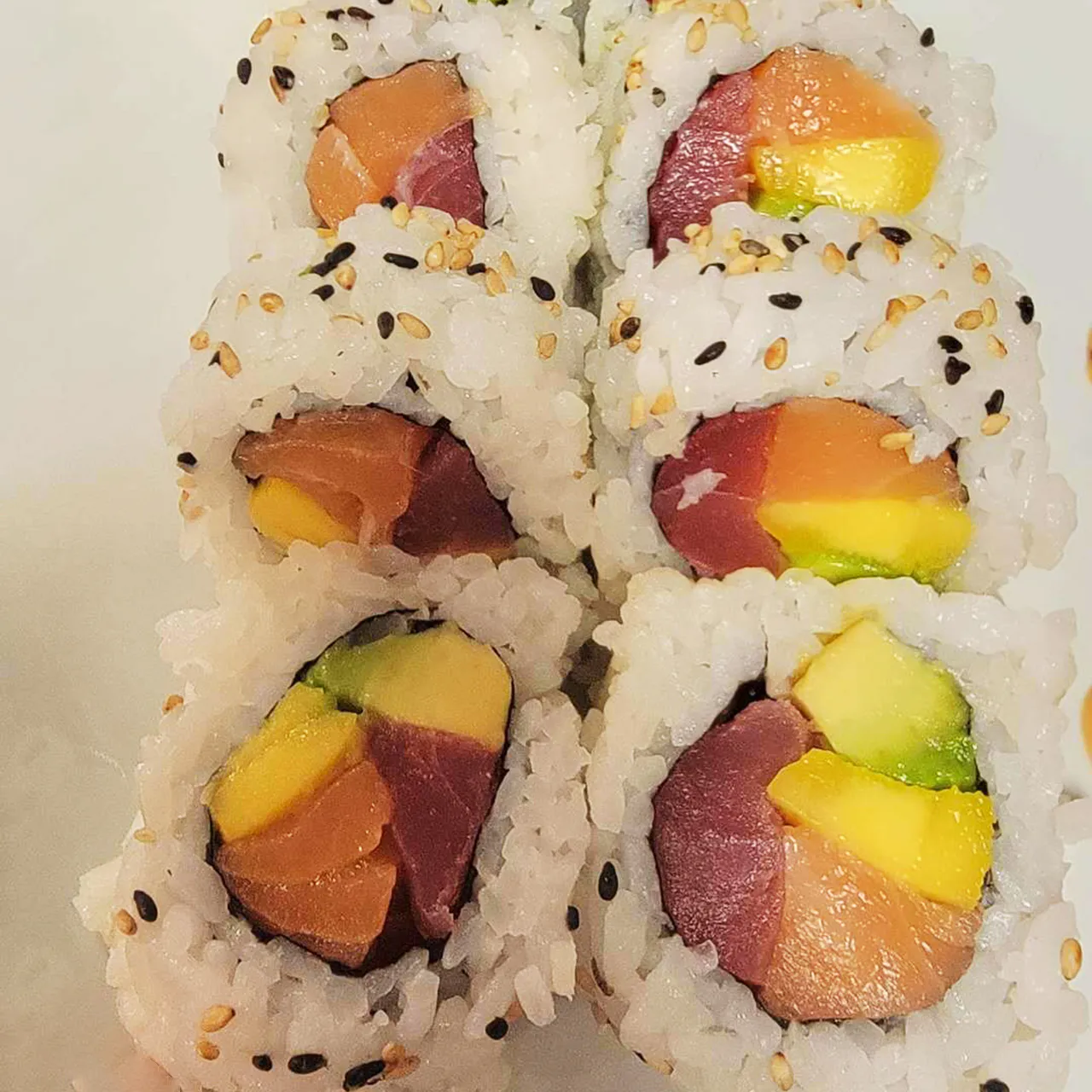 Rainbow sushi roll with salmon tuna and avocado at Yen Sushi & Sake，a Japanese Restaurant in Hillsboro