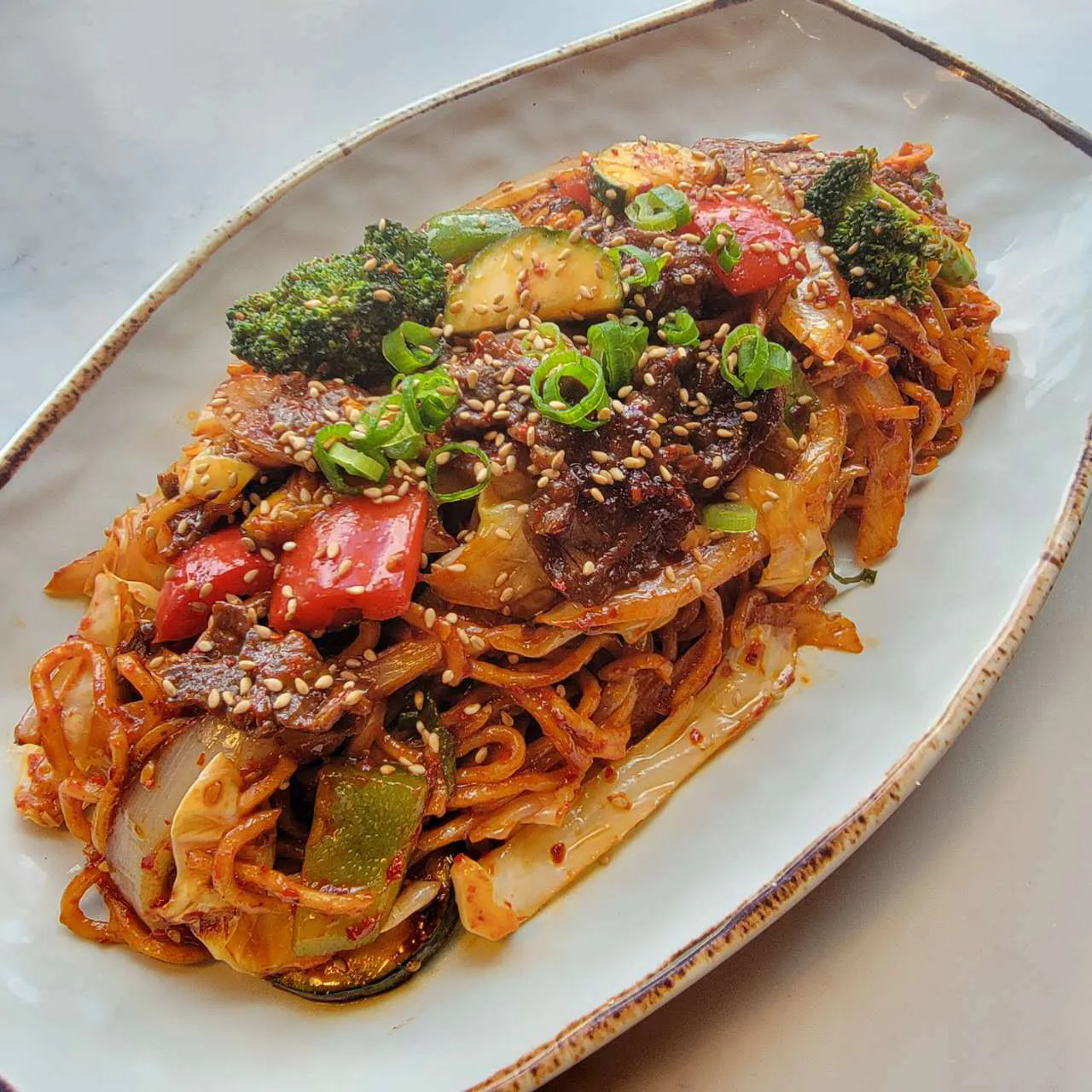 Spicy beef stir fried noodles with vegetables at Yen Sushi & Sake，a Japanese Restaurant in Hillsboro